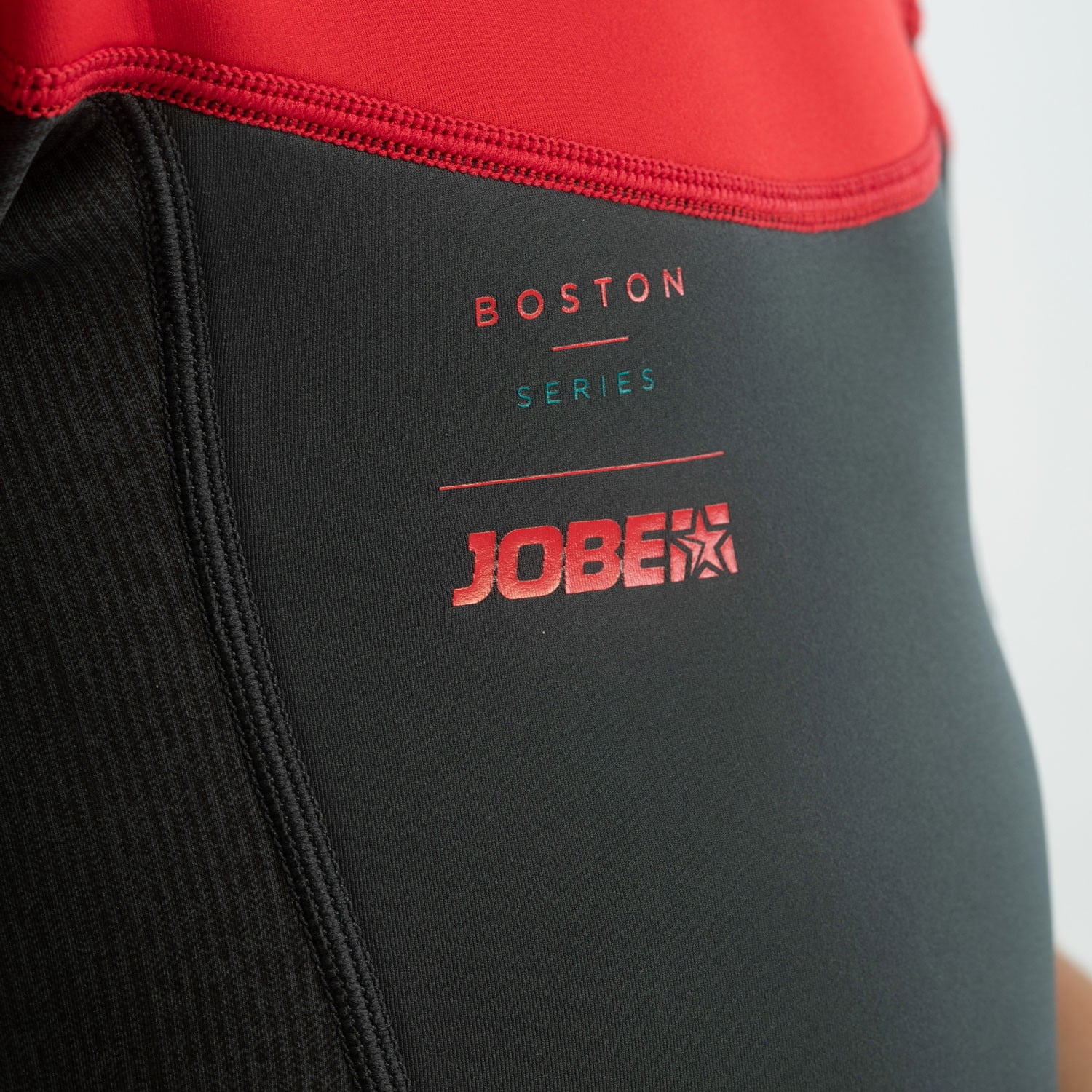 NEOPRENOS NIÑOS JOBE NEGRO Y ROJO